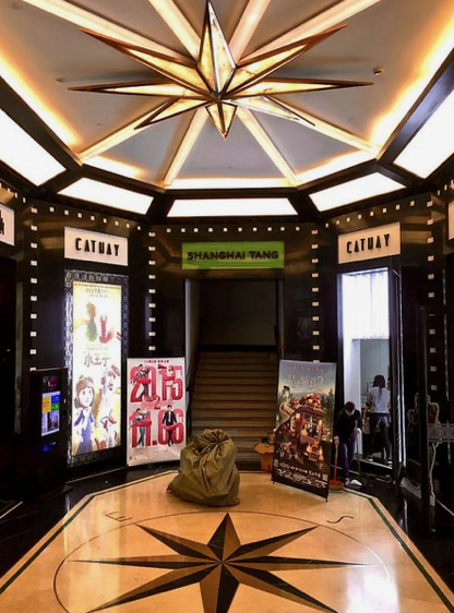 Shanghai interior with geometric ceiling details and Cathay signage