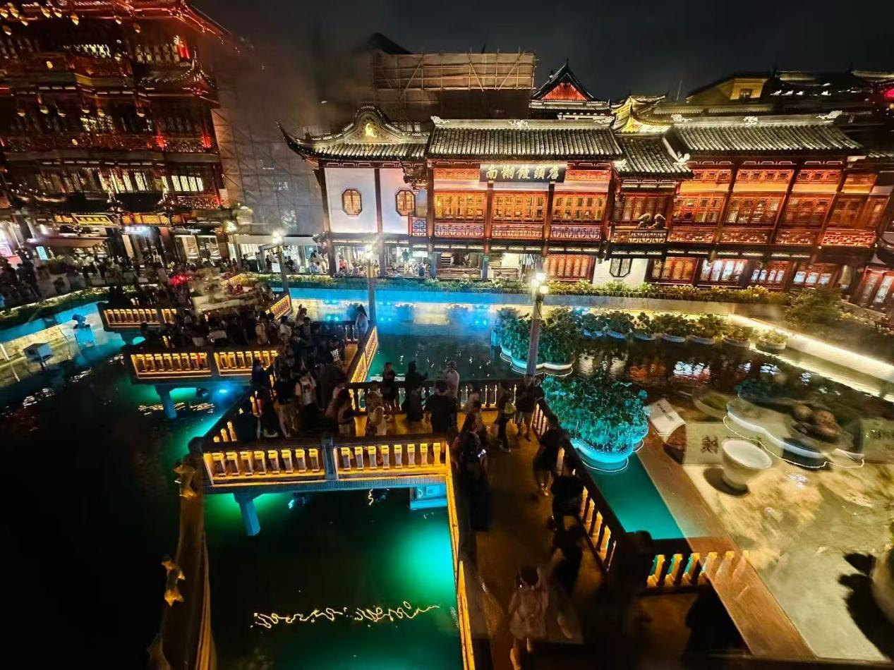 Illuminated traditional architecture and ponds in Shanghai's Yu Garden area